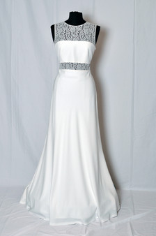 Strong-lined wedding dress with a panelled design of Chantilly lace and crepe.