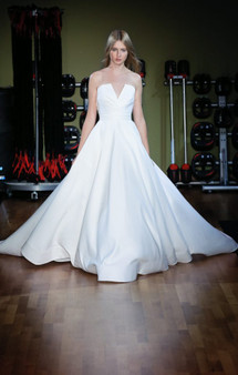 Matte satin ball gown with notched draped bodice.