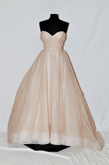 Blush shimmer tulle ball gown, strapless sweetheart neckline, draped bodice and natural waist, box pleated skirt with side pockets, chapel train.