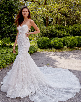 lightly had beaded sculptured neckline, fit and flare silhouette with sheer bodice, all over three dimensional flowers, chapel train.