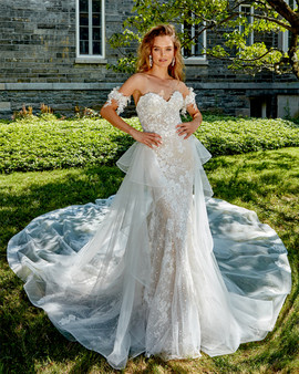 sculptured neckline with hand beaded three dimensional lace with matching cuffs, lightly hand beaded all over lace fit and flare gown, sparkle underneath top layer, with removable hand embroidered three dimensional chapel train