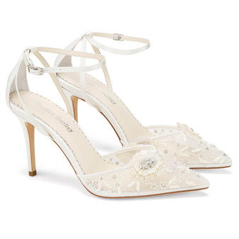 Sequined petals are meticulously stitched together to form two brilliant roses on the toe of Norah, white floral heels. Shimmering beads and sequins catch the light with every glittering step. These ivory flower shoes with ankle strap feature a seductive cutout design at the heel.
